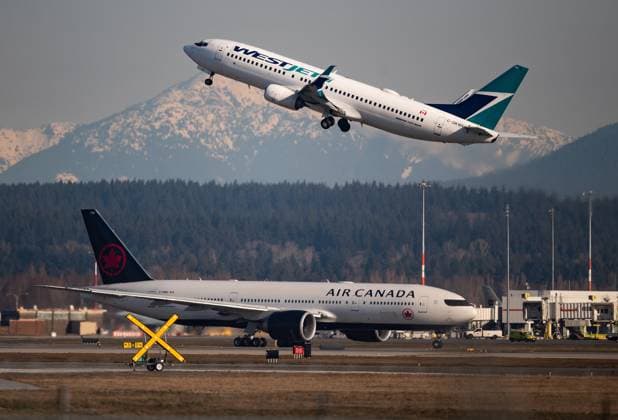 September 16, 2022, Richmond, Bc, Canada: An Air Canada flight taxis to a runway as a WestJet flight takes off at Vancouver International Airport, in Richmond, B.C., on Friday, March 20, 2020. Richmond Canada  - ZUMAc35_ 20220916_zaf_c35_209 Copyright: xDarrylxDyckx