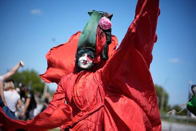 (250622) -- WARSAW, June 22, 2025 -- A performer in a flower-themed costume is seen during the Wianki Festival celebration in Warsaw, Poland, June 21, 2025. The event is a local tradition to mark the summer solstice, blending folklore, music, and modern festivities. (Photo by Xinhua) POLAND-WARSAW-WIANKI FESTIVAL JaapxArriens 