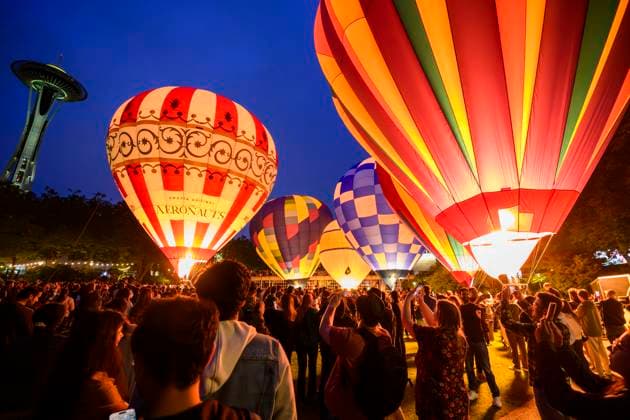 June 22, 2025, Seattle, Washington, USA: A large crowd gathers at the Space Needle to watch a first-time ballooning event. Six one-hundred-foot hot air balloons light up the evening sky. The Glow joins SeattleÃ¢â‚¬â ¢s summer-long celebrations, each embracing the neighborhoodÃ¢â‚¬â ¢s unique flavor. Seattle USA - ZUMAsr6_ 20250622_znp_sr6_002 Copyright: xShanexSrogix