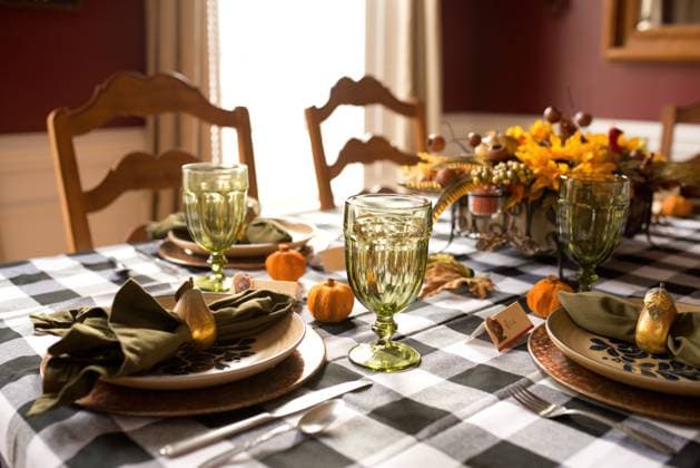 Thanksgiving table setting decorated with pumpkins, pears, and flowers Portage, Michigan, United States R_TBFG250620A-1772193-01