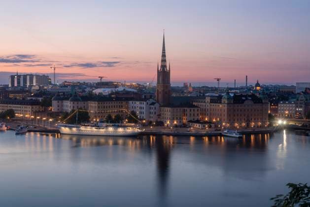 Scenic view of Stockholm s Riddarholmen at sunset with reflections on Lake Malaren, TAMF04805