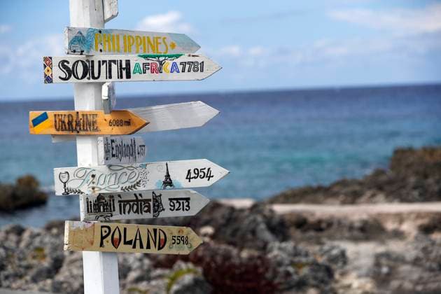 Country distance sign, showing the direction and distance to countries around the world. Cayman Islands. Cayman Islands