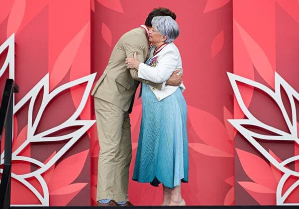 July 1, 2025, Ottawa, On, Canada: Canadian-American actor Ryan Reynolds, left, shares a hug with Gov. Gen. Mary Simon after invested as an Officer to the Order of Canada during Canada Day celebrations at LeBreton Flats in Ottawa, on Tuesday, July 1, 2025. Ottawa Canada  - ZUMAc35_ 20250701_zaf_c35_056 Copyright: xSpencerxColbyx