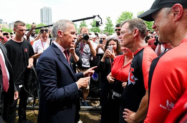 July 1, 2025, Ottawa, On, Canada: Prime Minister Mark Carney, left, speaks with Darrell Fox, brother to the late Terry Fox following Canada Day celebrations at LeBreton Flats in Ottawa on Tuesday, July 1, 2025. Ottawa Canada  - ZUMAc35_ 20250701_zaf_c35_060 Copyright: xSpencerxColbyx