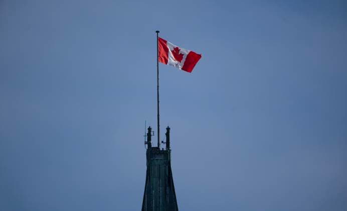 February 14, 2025, Ottawa, On, Canada: The Canadian flag flies over the Peace Tower on Parliament Hill, Friday, Feb. 14, 2025 in Ottawa. Ottawa Canada  - ZUMAc35_ 20250214_zaf_c35_207 Copyright: xAdrianxWyldx