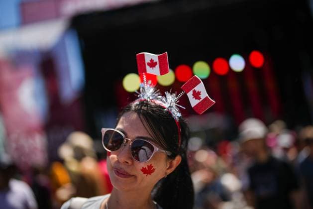 July 1, 2025, Vancouver, Bc, CANADA: A woman wears a headband with Canadian flags while attending Canada Day festivities, in Vancouver, on Tuesday, July 1, 2025. Vancouver CANADA  - ZUMAc35_ 20250701_zaf_c35_103 Copyright: xDarrylxDyckx