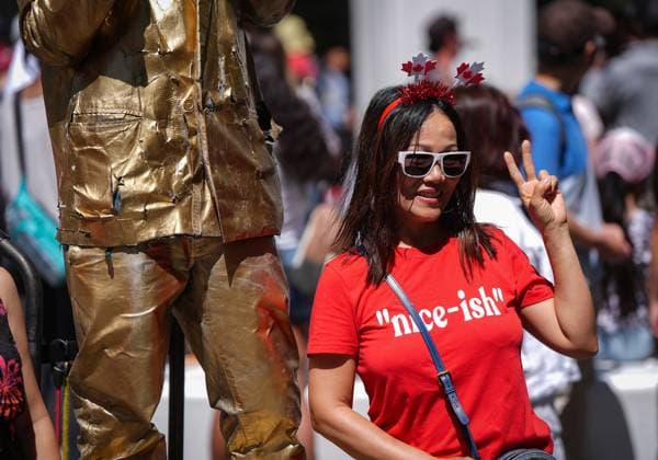 July 1, 2025, Vancouver, Bc, CANADA: A patriotically dressed woman poses with a street performer during Canada Day festivities, in Vancouver, on Tuesday, July 1, 2025. Vancouver CANADA  - ZUMAc35_ 20250701_zaf_c35_107 Copyright: xDarrylxDyckx
