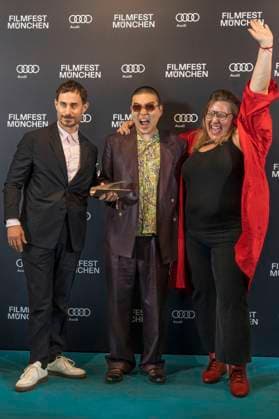 Clemens Schick , Soujiro Sanada und Anna Hints bei der Preisverleihung auf dem 42. Filmfest München 2025 im Amerikahaus. München, 05.07.2025