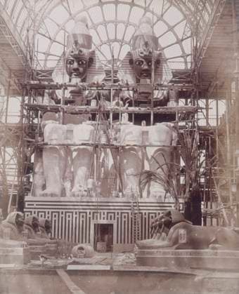 RECORD DATE NOT STATED The Colossi of Aboo Simbel in Process of Painting, Crystal Palace, Sydenham, 1852-1854. Designed by Sir Joseph Paxton to house the Great Exhibition of 1851 in Hyde Park, the Crystal Palace was reconstructed and enlarged in Sydenham in 1852. The first column was raised on 5 August 1852 and the palace was opened by Queen Victoria on 10 June 1854. Many exhibitions and events were subsequently held at the Crystal Palace until it burnt down on 30 November 1936. The park contained a motor racing circuit from 1937 until 1972 and the famous athletics track dates back to the foundation of the Crystal Palace Athletics Club in 1868. Plate 64 from Photographic Views of the Progress of the Crystal Palace, Sydenham. Taken during the progress of the works  Copyright:HeritagexArt HeritagexImagesxPhilipxHenryxDelamottex IMAGO