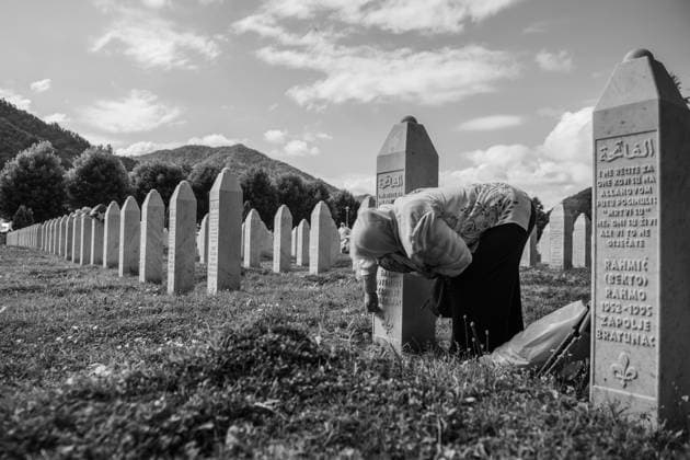 July 11, 2025, Potocari, Bosnia and Herzegovina: A woman is cleaning the grave of her loved one in PotoÄ?ari graveyard. In this place every year, on the 10th and 11th of july, the commemoration for the people who got killed takes place, with prayers and ceremonies. In 1995, during the Bosnian War, the city was the site of the killing of more than 8.000 Bosniak men and boys, perpetrated by the units of the Bosnian serb army of Republika Srpska, led by Ratko MladiÄ‡, because they were muslim. This happened in a zone defined safe by United Nation (UN). On July 11, 2025, the International Day of Reflection and Commemoration of the 1995 Genocide in Srebrenica takes place.. Sad people are passing by. In this place every year, on the 10th and 11th - ZUMA 20250711_mda_b283_171 Copyright: xSebastianoxBaccix