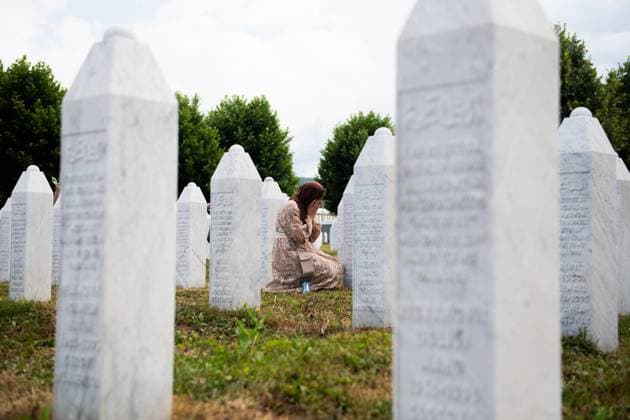 July 10, 2025, Potocari, Bosnia and Herzegovina: a woman crying while praying between the graves in the PotoÄ?ari memorial. In this place every year, on the 10th and 11th of july, the commemoration for the people who got killed takes place, with prayers and ceremonies. In 1995, during the Bosnian War, the city was the site of the killing of more than 8.000 Bosniak men and boys, perpetrated by the units of the Bosnian serb army of Republika Srpska, led by Ratko MladiÄ‡, because they were muslim. This happened in a zone defined safe by United Nation (UN). On July 11, 2025, the International Day of Reflection and Commemoration of the 1995 Genocide in Srebrenica takes place. Potocari Bosnia and Herzegovina - ZUMA 20250710_mda_b283_198 Copyright: xSebastianoxBaccix