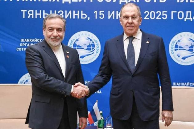 CHINA, TIANJIN - JULY 15, 2025: Iran s Minister of Foreign Affairs Seyed Abbas Araghchi (L) and Russiaâ€™s Minister of Foreign Affairs Sergei Lavrov shake hands during a meeting on the sidelines of the 2025 meeting of the SCO Council of Foreign Ministers. Russian Ministry of Foreign Affa  82474855