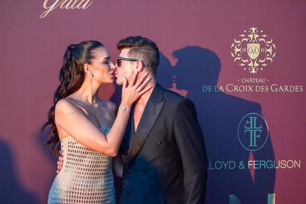 RECORD DATE NOT STATED 4th Knights of Charity Gala of Milutin Gatsby - Cannes Robin Thicke and is wife April Love Geary attending the photocall during 4th Knights of Charity Gala of Milutin Gatsby at Chateau de la Croix des Gardes in Cannes, France on July 17, 2025. Photo by Cyril Chateau ABACAPRESS.COM Cannes France  Copyright: xChateauxCyril ABACAx
