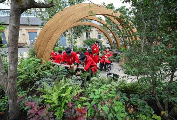 London Square Chelsea Pensioners show garden Chelsea Pensioners Archie Ferguson, 87 years old (L) and Alan Rutter, 77 years old plant the final flowers in the London Square Chelsea Pensioners show garden, which won a gold medal at this year s Chelsea Flower Show, and which has now been transported in it’s entirety to its new home at the Royal Hospital Chelsea.  Copyright: xRichardxPohlex NINTCHDBPICT001010609654