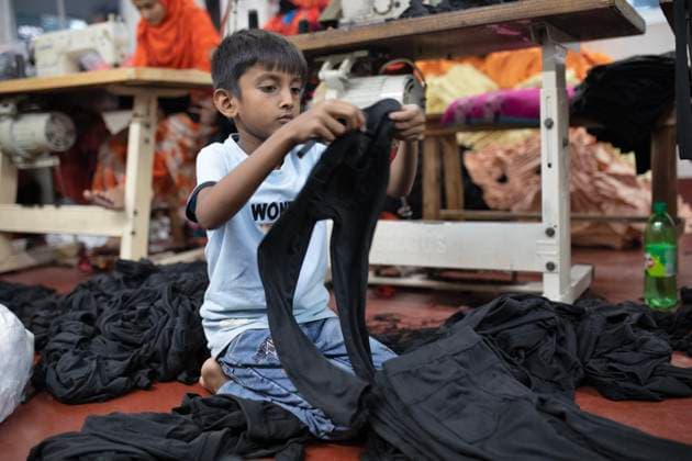 Child labour in Narayanganj, Bangladesh - 19 Jul 2025 An underage worker seen working at a local Ready Made Garment (RMG) factory. In various local factories in Bangladesh, related to Ready Made Garments (RMG) sectors, its often seen that the factory owners hire child labour or underage labour for work so that they can pay less wages. These underage workers work hard but get paid less compared to their adult co-workers due to their age and as they can not get work somewhere else. Large RMG factories, who export goods in different countries, maintain strictly no child labour policy but the local factories still do not maintain any child labour policies. Narayanganj Bangladesh Copyright: xZiaulxHaquexOisharjhx xSOPAxImagesx _IA_4600 copy