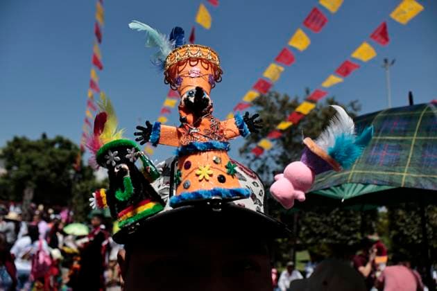 July 19, 2025, Chalco, State Of Mexico, Mexico: In the volcanic area, the celebration of SANTIAGO THE APOSTOLE, the patron saint of Chalco, State of Mexico, begins with the traditional Chinelos, native to Tlayacapan, Tepozotlan, and Yautepec, State of Morelos. These people dance through the streets wearing handmade costumes made with different fabrics, materials, paints, and masks. They originated during the colonial era to mock the Spanish, which is why their costumes have extravagant decorations and their masks resemble the faces, light skin, and colored eyes of the foreigners who invaded Mexico. The word Chinelo comes from the Nahuatl word meaning disguised Chalco Mexico - ZUMAp204 20250719_zip_p204_003 Copyright: xJosuexPerezx