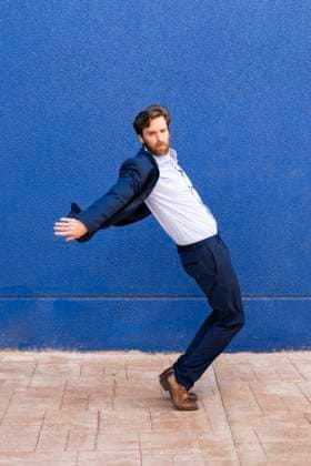 Creative Highlight Symbolbilder Confident businessman in motion against a blue background model released, Symbolfoto, LMCF02555