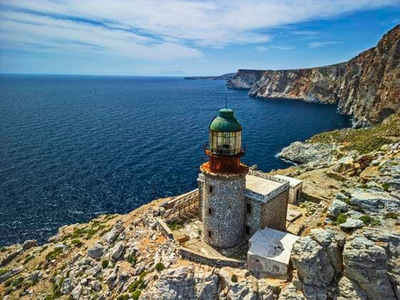 Lighthouse Pharos Lithari on rocky coast of Skyros island Greece, ANSF01466