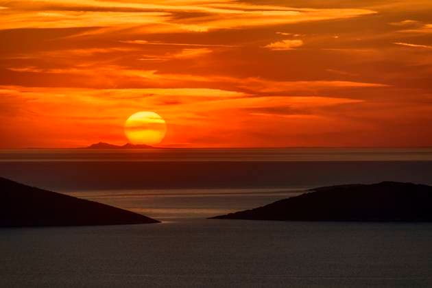 Creative Highlights World Colorful sunset over Kalamitsa bay on the island of Skyros Greece, ANSF01474