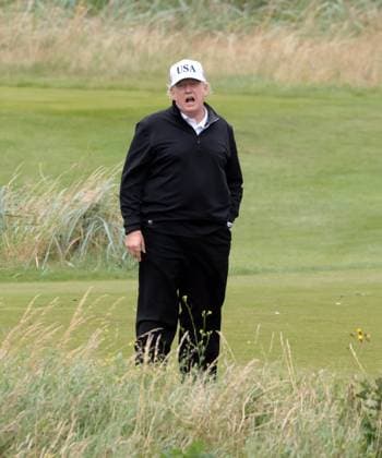American President Donald Trump waves to the media whilst playing golf at Turnberry Golf Club, Ayrshire in Scotland on Sunday, July 27, 2025. Trump is on a four day visit to Scotland where he will be playing golf and meeting International leaders for trade discussions.  LON2025072707 HUGOxPHILPOTT