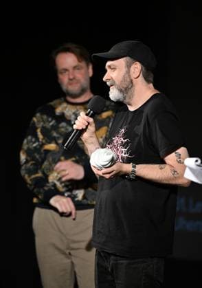 Lukas Moodysson, Swedish poet, novelist, film director and non-conformist, one of the most prominent personalities of the local culture in general, receives the ACFK Annual Award within the 51st Summer Film School in Uherske Hradiste, Czech Republic, July 27, 2025. On the left is programme director Jan Jilek. (CTKxPhoto DaliborxGluck) CTKPhotoP2025072705405  CTKPhotoP2025072705405