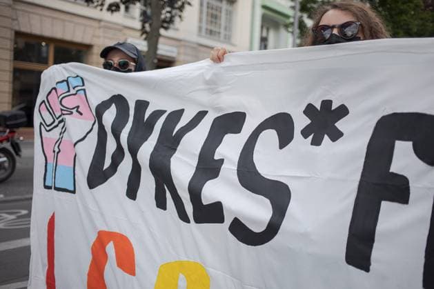 July 25, 2025, Berlin, Germany: A banner at the dyke march berlin 2025 with the symbol of power and transinclusivity Berlin Germany - ZUMA 20250725_mda_b284_677 Copyright: xZairaxBiaginix