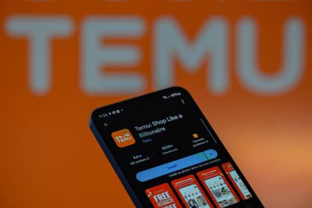 Temu - EU Digital Service Act - Photo Illustration The Temu app is displayed on a mobile phone with Temu seen in the background, in this photo illustration in Brussels, Belgium, on July 30, 2025. Brussels Belgium  Copyright: xJonathanxRaax originalFilename: raa-temueudi250730_npfcy.jpg