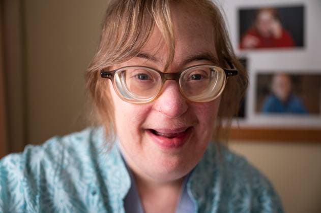 Creative Highlights Symbolbilder Indoor portrait of a happy 42 yo woman with the Down Syndrome, Tienen, Belgium 3 AUG 2025 Model released