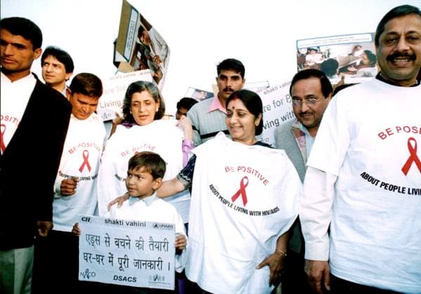India Starts Clinical Trials of HIV AIDS Vaccine Feb 07, 2005; New Delhi, INDIA; (FILE PHOTO) Indian Health Minister Sushma Swaraj (C) comforts HIV positive boy (holding banner) as she participate in the Walk for Life organised by Shakti Vahini a Non Governmental Organisation (NGO) in collaboration with the National AIDS Control Organisation (NACO), on November 30, 2003, on the eve of World AIDS Day. India, which has some 4.58 million people living with HIV AIDS, on February 7, 2005 launched its first human clinical trials of a vaccine designed to prevent HIV AIDS. New Delhi INDIA Copyright: xTCxMalhotrax