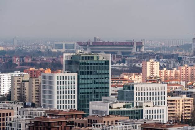 The modern buildings of the Sei Milano district stand in the foreground, while the San Siro stadium is visible in the background among the city s buildings. Milan (Italy), March 13th, 2025 Milan Italy - ZUMAesty 20250313_aac_m169_177 Copyright: xDimitarxHarizanovx