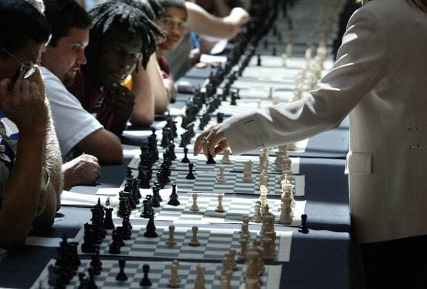 Woman Plays 350 Chess Matches Simultaneously Jul 30, 2005; Palm Beach, FL, USA; Grandmaster Susan Polgar (cq) attempted to set a Guinness World Record Monday at The Gardens mall by playing 350 chess matches simultaneously. The first woman to become a Grandmaster, she is currently the 1 ranked female chess player in the United States. The purpose of the event is to promote U.S. Chess and raise money for the Susan Polgar Foundation. More than 350 Chess stations were set up in the Gardens Mall. Each chess station consisted of a table and chair, a chess board and pieces. Each player was assigned to a station. Susan walked along the rows of tables. At each station she observed her opponent move, responded with her move, and then walked to the Copyright: xBrucexR.xBennettx