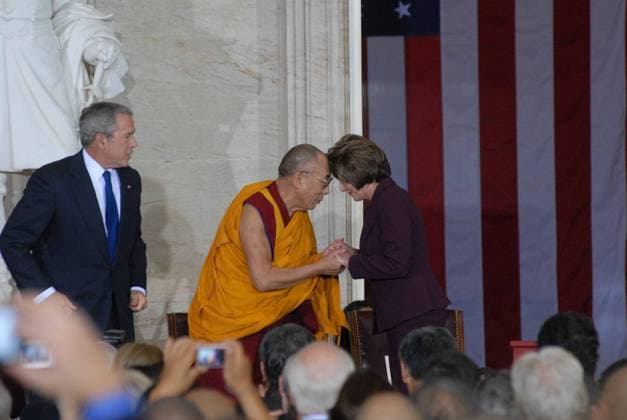 The Dalia Lama on Capitol Hill October 17, 2007 - Washington, DC, United States of America - Washington DC 10-17-2007 His Holiness The 14th Dalia Lama Lhamo Dondrub of Tibet greets Speaker of The House Nancy Pelosi with the Buddhist traditional head to head form of greeting. President George W. Bush looks on from the left. Copyright: xMarkxReinsteinx