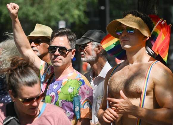 August 10, 2025, Montreal, Pq, Canada: Members of the crowd observe a moment of silence during the Pride parade in Montreal, Sunday, August 10, 2025. Montreal Canada  - ZUMAc35_ 20250810_zaf_c35_014 Copyright: xGrahamxHughesx