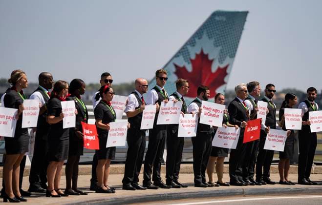 August 11, 2025, Montreal, Pq, CANADA: Air Canada flight attendants hold a silent protest at Montreal-Pierre Elliott Trudeau International Airport in Montreal on Monday, Aug. 11, 2025. Montreal CANADA  - ZUMAc35_ 20250811_zaf_c35_001 Copyright: xChristinnexMuschix