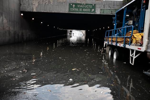 August 11, 2025, Mexico, Cdmx, Mexico: In the Venustiano Carranza region, very close to Mexico City International Airport (AICM), flooding occurred due to recent heavy rains. The vehicles transported to the airport were affected, especially under bridges, where rainwater and sewage from the sewers covered some cars, preventing their owners from getting them out in time. Mexico City sanitation and water workers are working constantly using machinery to remove water from these tunnels and unclog the sewers to remove vehicles that have been totally lost. Mexico Mexico - ZUMAp204 20250811_zip_p204_050 Copyright: xJosuexPerezx