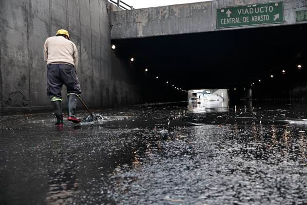 August 11, 2025, Mexico, Cdmx, Mexico: In the Venustiano Carranza region, very close to Mexico City International Airport (AICM), flooding occurred due to recent heavy rains. The vehicles transported to the airport were affected, especially under bridges, where rainwater and sewage from the sewers covered some cars, preventing their owners from getting them out in time. Mexico City sanitation and water workers are working constantly using machinery to remove water from these tunnels and unclog the sewers to remove vehicles that have been totally lost. Mexico Mexico - ZUMAp204 20250811_zip_p204_060 Copyright: xJosuexPerezx