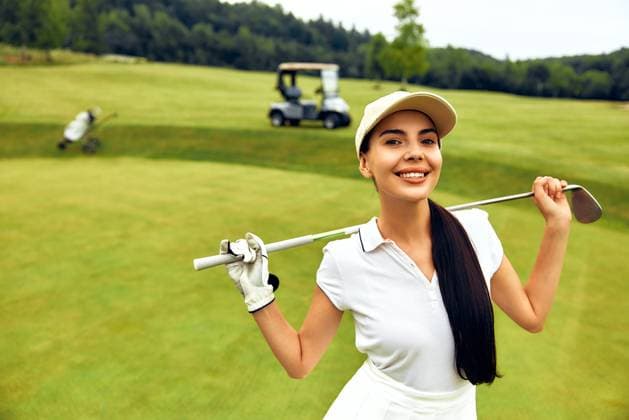 Creative Highlights Symbolbilder A woman golfer is enjoying her time at a beautifully scenic golf course alongside a golf cart A fashionable woman golfer confidently poses on a beautifully manicured lush green golf course, proudly showcasing her impressive skills with a golf club beside a golf cart parked in the background Model Released OrionProduction_ID29911_1010653_051 Copyright: xTYMOSHCHUKxANDRIIx