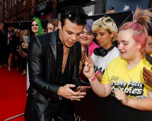 August 12, 2025, London, United Kingdom: YUNGBLUD aka Dominic Richard Harrison poses with a fan at the YUNGBLUD. Are You Ready, Boy? Premiere at the Vue in Leicester Square. London United Kingdom - ZUMAs197 20250812_aaa_s197_446 Copyright: xCatxMorleyx