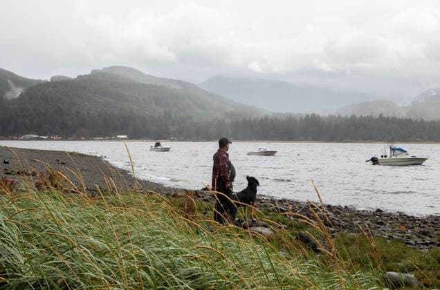 August 16, 2025, Port Alberni, Bc, CAN: Millworker Kayne Osland looks across the Alberni Inlet with his dog Meara towards the Underwood Mountain wildfire while camping at the Macktush Creek Campsite off Canal Main Rd. south of Port Alberni, B.C., on Saturday, August 16, 2025. Port Alberni CAN  - ZUMAc35_ 20250816_zaf_c35_128 Copyright: xChadxHipolitox