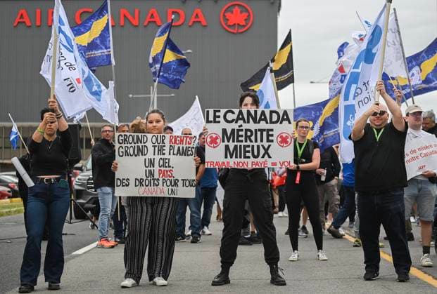 August 17, 2025, Montreal, Pq, Canada: Air Canada employees and union members protest outside the Air Canada headquarters in Montreal, Sunday, Aug. 17, 2025, after the federal government intervened in the labour dispute between the airline and the union representing its flight attendants, ordering binding arbitration and operations to resume. Montreal Canada  - ZUMAc35_ 20250817_zaf_c35_004 Copyright: xGrahamxHughesx