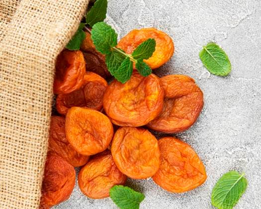 Dried apricots on a grey concrete background Model Released OlenaRudo_ID30936_1049467_092 Copyright: xx
