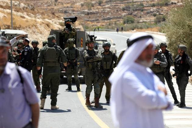 Israeli settlers prevent Palestinians from accessing their land in the West Bank HEBRON, WEST BANK - AUGUST 18: Israeli forces take security measures as Israeli settlers prevent Palestinians from accessing their land in Sa’ir town of the city of Hebron in the northeast of the West Bank on August 18, 2025. According to reports, despite an Israeli court ruling allowing Palestinians to return to the lands in question, Jewish settlers continue to exert pressure on the area, effectively preventing Palestinian farmers from accessing their land. Wisam Hashlamoun Anadolu Hebron West Bank. Editorial use only. Please get in touch for any other usage.  Copyright: x2025xAnadoluxWisamxHashlamounx