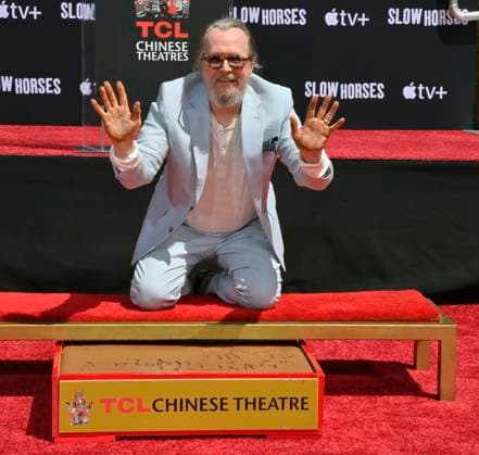 English actor Gary Oldman participates in a hand and footprint ceremony immortalizing him in the forecourt of the TCL Chinese Theatre (formerly Grauman s) in the Hollywood section of Los Angeles on Friday, August 22, 2025.  LAP2025082203 JIMxRUYMEN