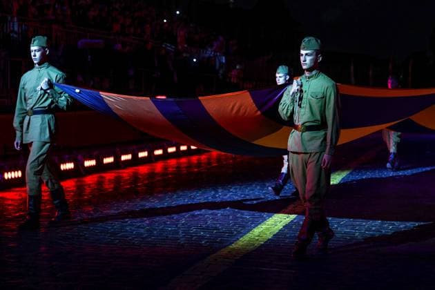 RUSSIA, MOSCOW - AUGUST 22, 2025: St George s ribbon is unfurled during the opening ceremony of the 17th Spasskaya Tower International Military Music Festival in Red Square. Sergei Bulkin TASS  83327820