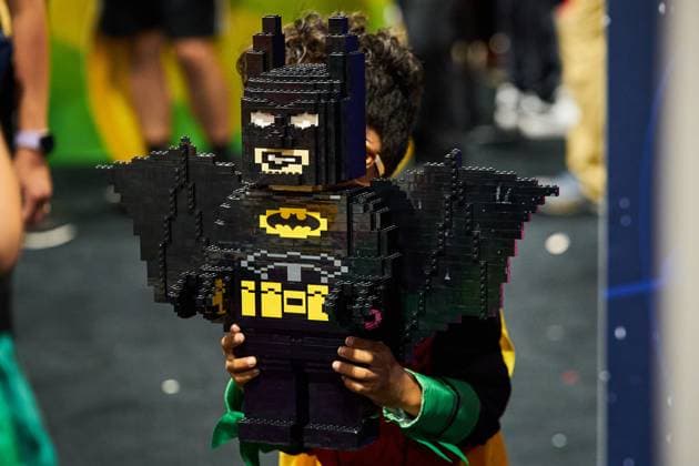 August 22, 2025, Toronto, On, Canada: A young convention-goer holds up a LEGO Batman on the second day of the annual Fan Expo convention in Toronto, on Friday, Aug. 22, 2025. Toronto Canada  - ZUMAc35_ 20250822_zaf_c35_143 Copyright: xSammyxKoganx
