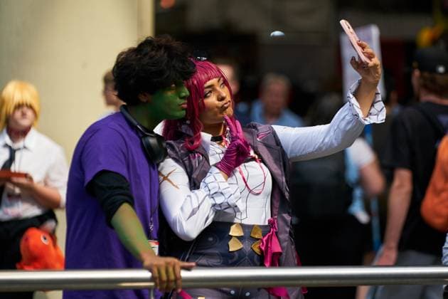 August 22, 2025, Toronto, On, Canada: Convention-goers in cosplay take selfies on the second day of the annual Fan Expo convention in Toronto, on Friday, Aug. 22, 2025. Toronto Canada  - ZUMAc35_ 20250822_zaf_c35_147 Copyright: xSammyxKoganx