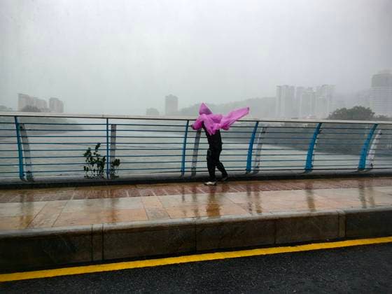 SANYA, CHINA - AUGUST 24: A local resident struggles to walk as Typhoon Kajiki brings strong winds and heavy rain on August 24, 2025 in Sanya, Hainan Province of China. Strong winds and heavy rain whipped South China s Hainan province and parts of Guangdong province on August 24, as Typhoon Kajiki passed over open waters to the south of Hainan and headed toward Vietnam s central coast.  Copyright: xChinaxNewsxServicex 111586697151