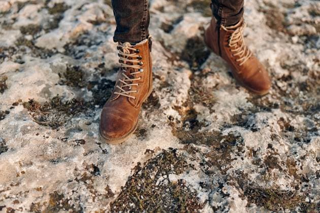 solitary figure in snowy landscape wearing brown boots and jeans atop hill solitary figure in snowy landscape wearing brown boots and jeans atop hill, model released, , 63212396.jpg RECORD DATE NOT STATED