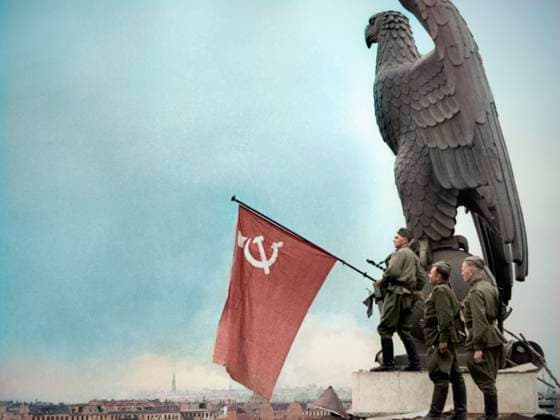 Berlin, Germany. Soldiers of the Red Army raise the flag of the Soviet Union over the Tempelhof airport after capturing the city during the Second World War. AI-Colourised from original ID 9521838. Yevgeny Khaldei TASS  81814862