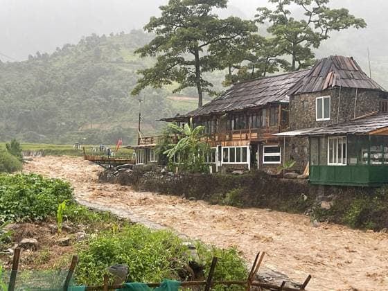 (250827) -- HANOI, Aug. 27, 2025 -- This photo taken on Aug. 26, 2025 shows a flood-affected area in northern Vietnam s Lao Cai province. The death toll from Typhoon Kajiki and the resulting floods in Vietnam has risen to seven, with one person still missing and 34 others injured, the Vietnam News Agency reported Wednesday. Typhoon Kajiki, the fifth storm of the year in Vietnam, made landfall earlier this week, lashing several northern and central provinces with heavy rain and strong winds. (VNA via Xinhua) VIETNAM-TYPHOON-KAJIKI-DEATH TOLL HuxJiali 